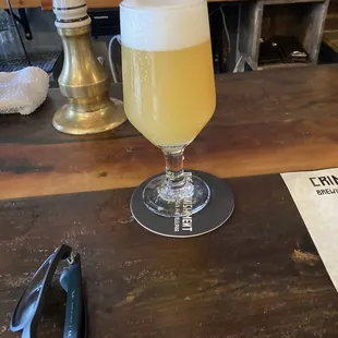 a glass of beer on a table