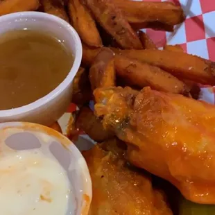 Wings with sweet potato fries. Blue cheese and special gold sauce