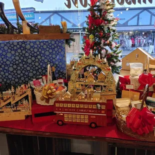 a display of christmas decorations and gifts