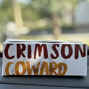 a sign on the dashboard of a car