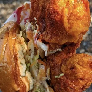 a fried chicken sandwich with coleslaw and coleslaw slaw