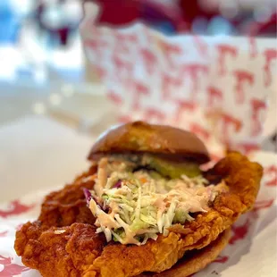 a fried chicken sandwich with coleslaw
