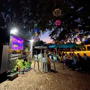 people sitting outside at night