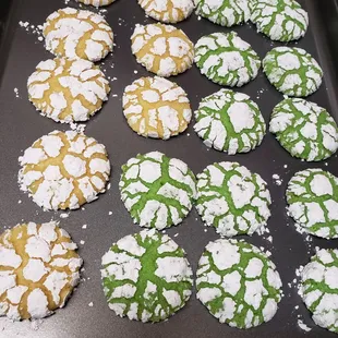 a tray of green and white cookies