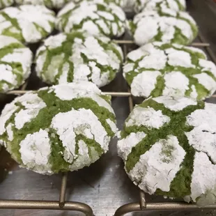 green and white cookies on a cooling rack