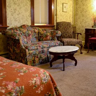 Room 15 Outpatient.  Private porch, sitting area and claw foot tub in bath.  Two queen beds.