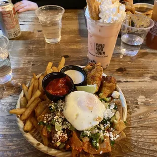 The "Just You" Tray (bò kho chilaquiles, sweet chili wings, fries)