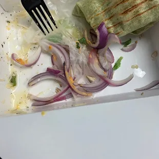 Lots of red onions from chicken hummus wrap.