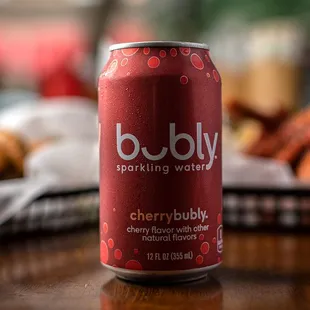 a can of budly sparkling beverage on a table