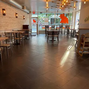 a restaurant with tables and chairs