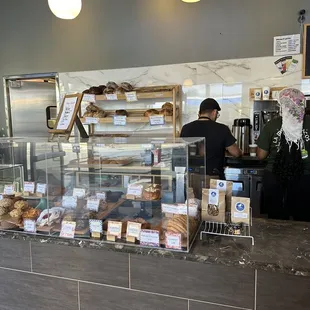 a counter with a variety of baked goods