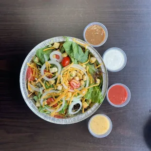 Green salad with choses of dressing