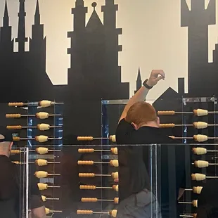 Dough being rolled in the form of their cones