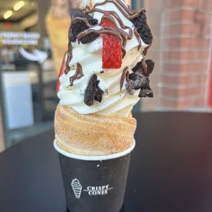 Crispy cone with Nutella filling, Oreo, and strawberry topping with Nutella drizzle