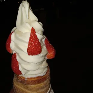 a strawberry and whipped cream cone