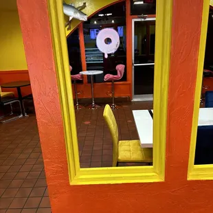 a yellow chair in a restaurant