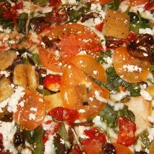 mission hill pizza (white pizza w/ mozzarella, caramelized onions, spinach, sun-dried tomatoes, plum tomatoes, eggplant, &amp; feta)