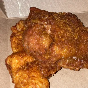 a piece of fried chicken in a box