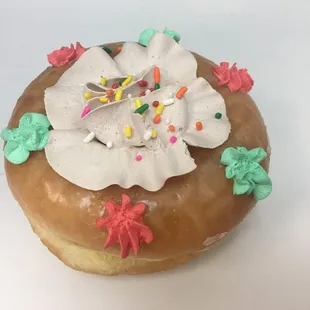 Glazed donut with whipped cream