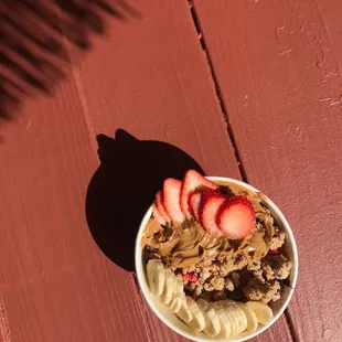 Large açaí bowl with strawberries and peanut butter