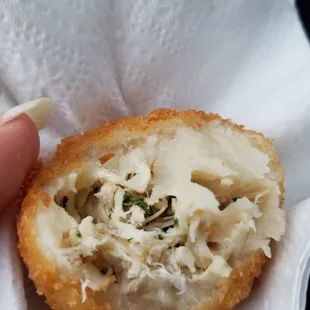Savory chicken and cheese inside the coxinha.