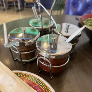 a variety of condiments on a table