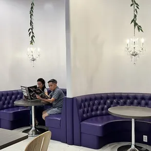 two people sitting at a table in a restaurant