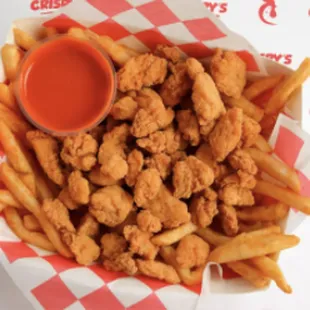a basket of fried chicken and fries