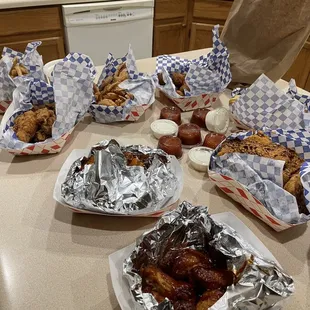 Shrimp, hot wings, fish fillets, chicken strips, fries, &amp; hush puppies