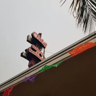 a neon sign for a mexican restaurant