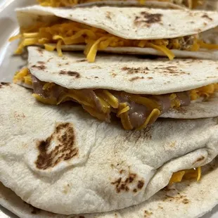 Chorizo, egg, and cheese tacos and bean and cheese tacos