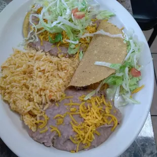 Tostada, taco, rice and beans