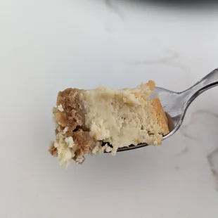 a piece of cheesecake on a fork