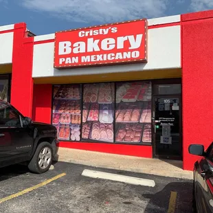 a car parked in front of a bakery