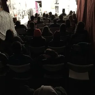 a crowd of people in a theatre