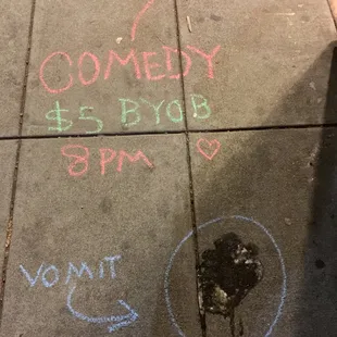 a chalk message on a sidewalk