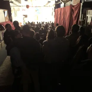 a large group of people in a dark room