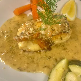 Chilean seabass in a roasted garlic, fresh dill white wine reduction limón sauce with side of veggies