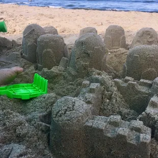 The sand is clean and has tiny shells and shell fragments, but they're rounded from the waves