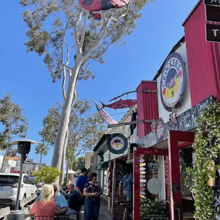 people sitting at tables outside