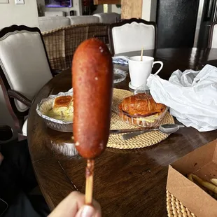a hot dog on a stick