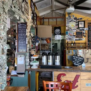 a bar with a lot of money on the wall