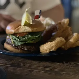 The $21 burger with greasy onion rings.