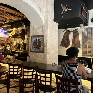 people sitting at the bar