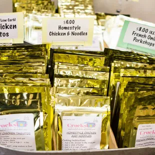 a bucket full of crocktar chicken taquitos