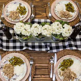 a table setting with plates of food