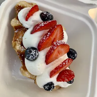 strawberries, blueberries, and whipped cream