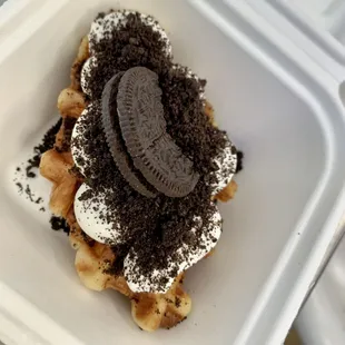 a waffle with oreo cookies on top