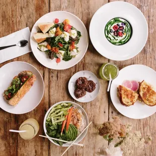 plates of food on a wooden table