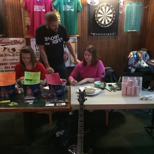a group of people sitting around a table